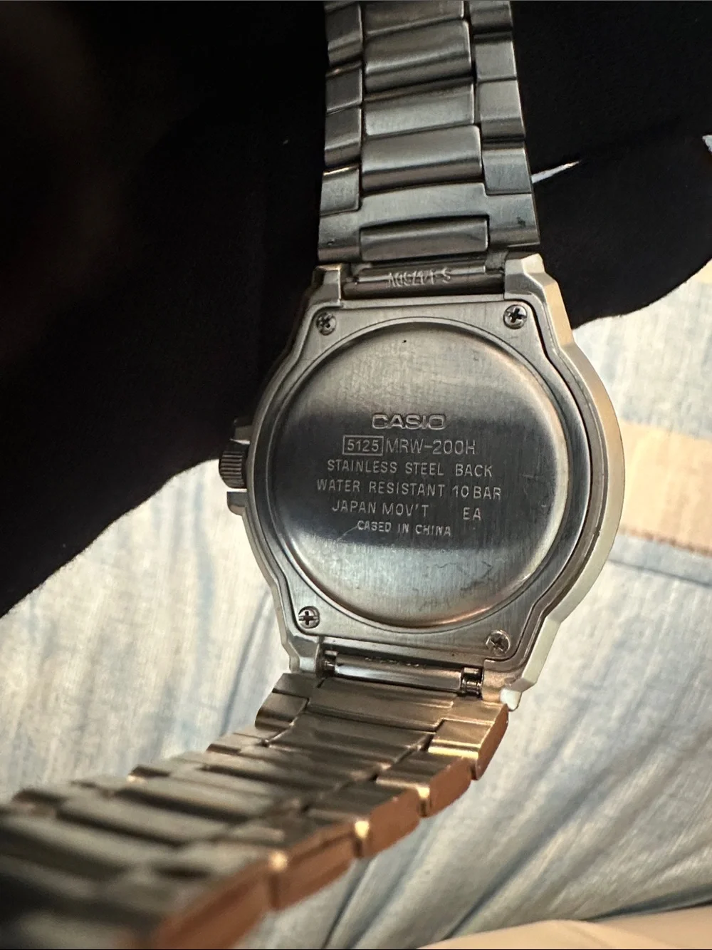 Casio Men's Silver Watch with White Dial and Black Bezel